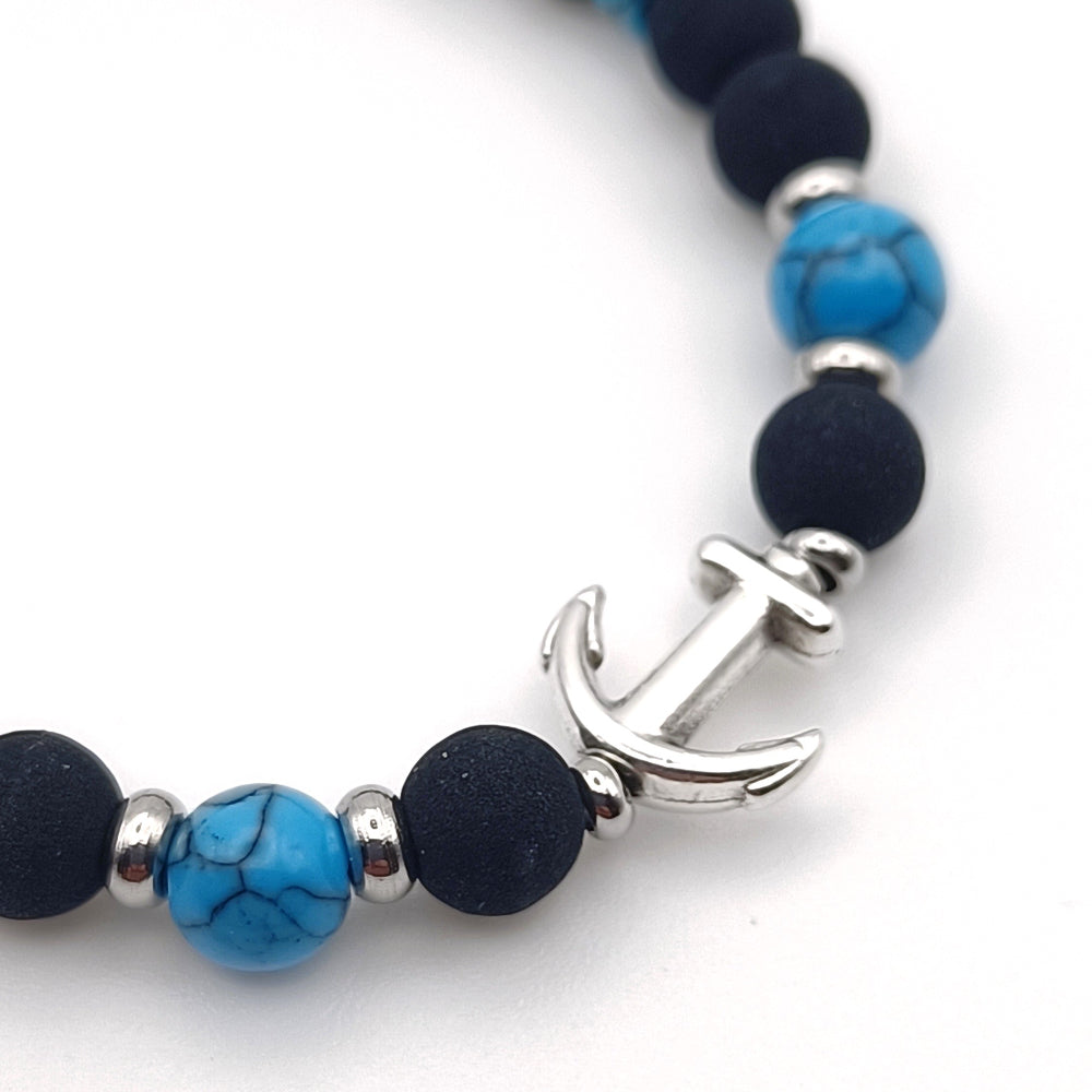 Particolare bracciale pietre laviche turchese ancora Giamas - pietre naturali