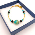 Bracciale del set con perle in pietra lavica, vetro di Murano verde e cristalli Swarovski